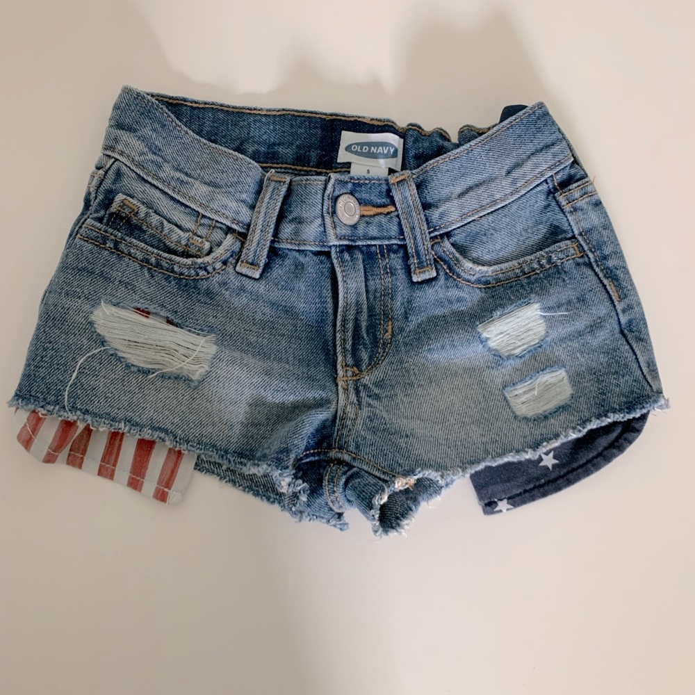 Short Jean, with flat under pocket and some rips